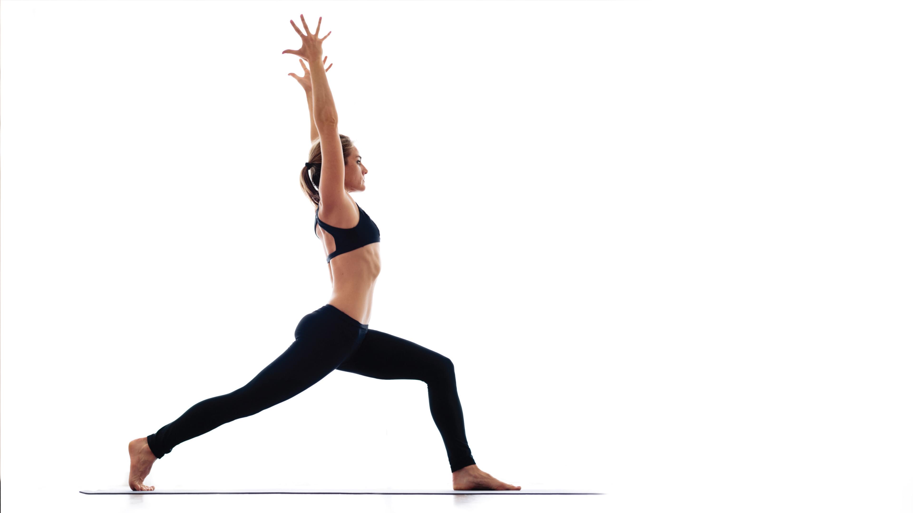 Woman in black leggings doing yoga