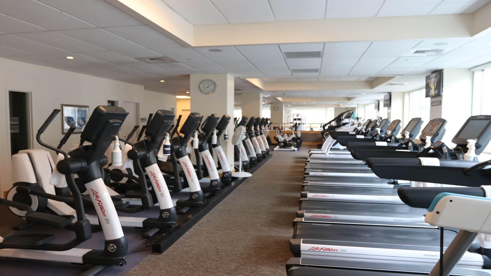 Rows of elliptical trainers and treadmills at PRO Club - Seattle