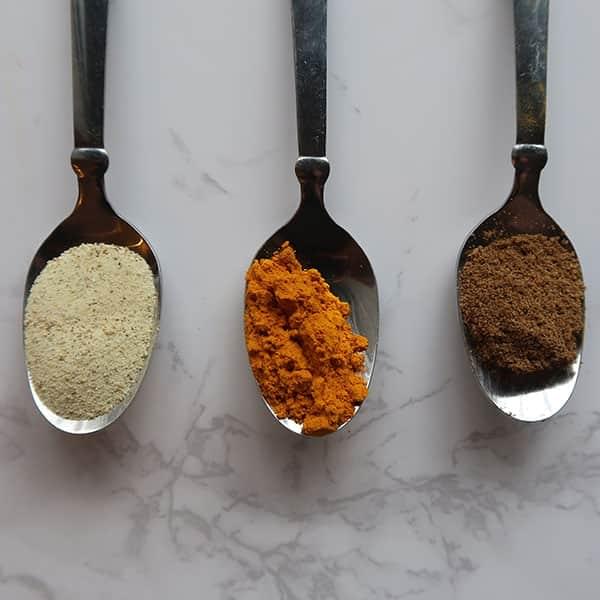 Three spoons with various spices
