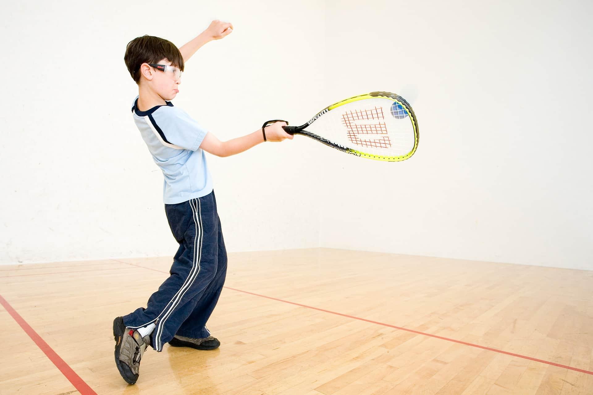 Boy practicing racquetball at PRO Club
