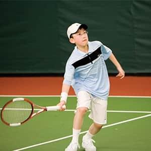Boy playing tennis at PRO Club
