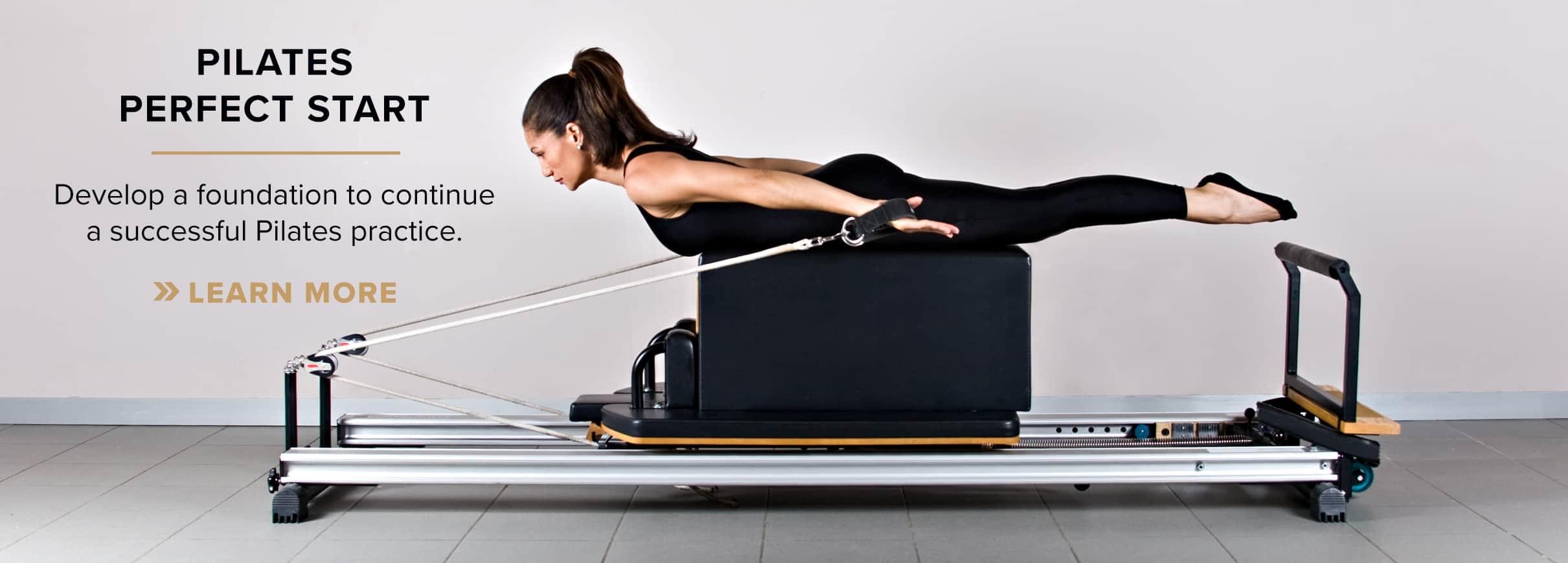 Woman in black workout uniform attending a Pilates class at PRO Club